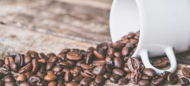 coffee beans, mug, wood table